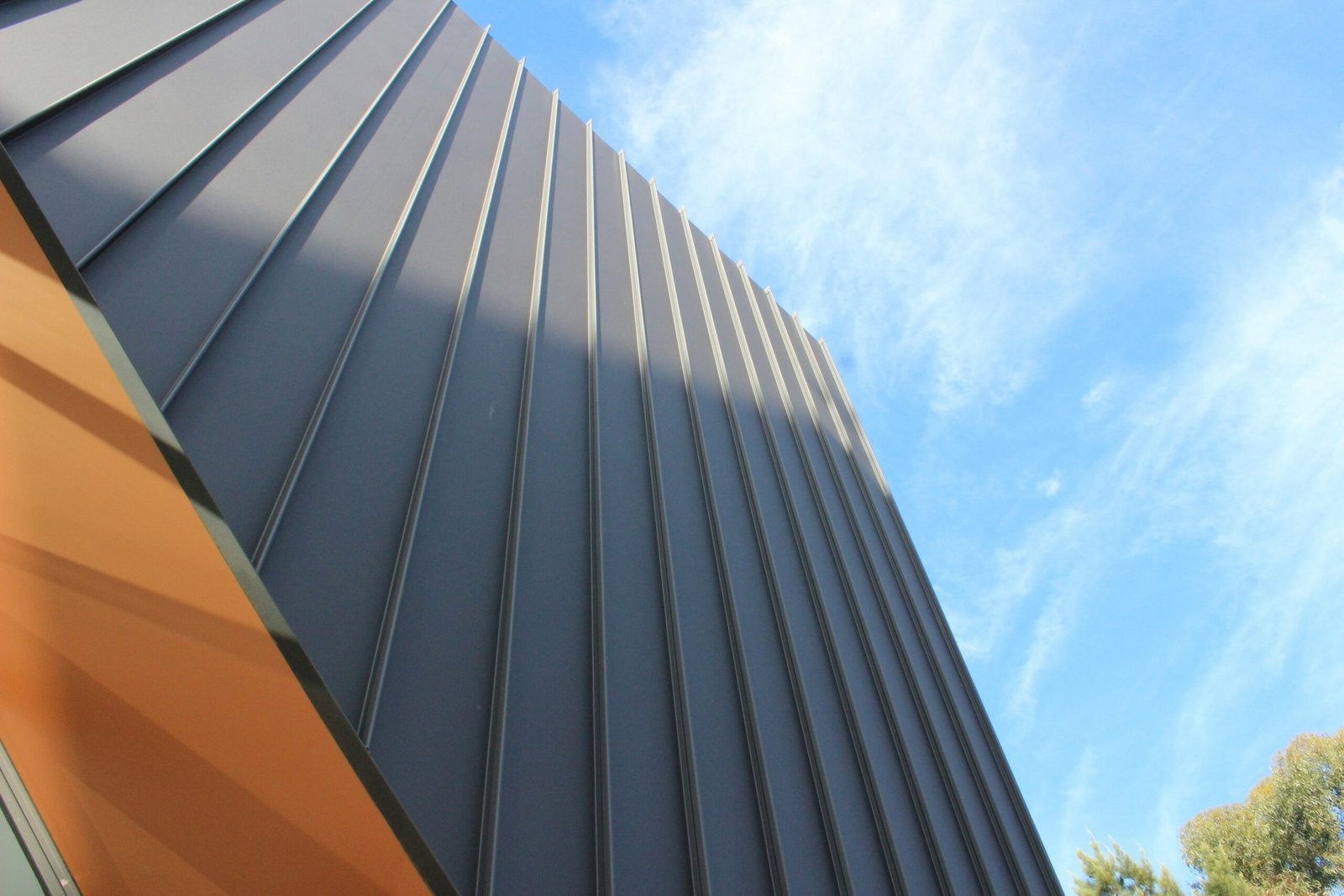 a close up of a building with a blue sky in the background